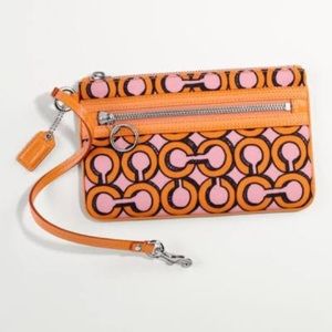 SOLD Authentic Coach wristlet. Pink/orange in colo